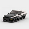 White and black Toyota AE86 brick model front three quarter view