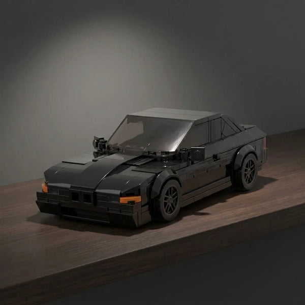 BMW 850 CSi Black Edition Brick Model displayed in a premium collector setup