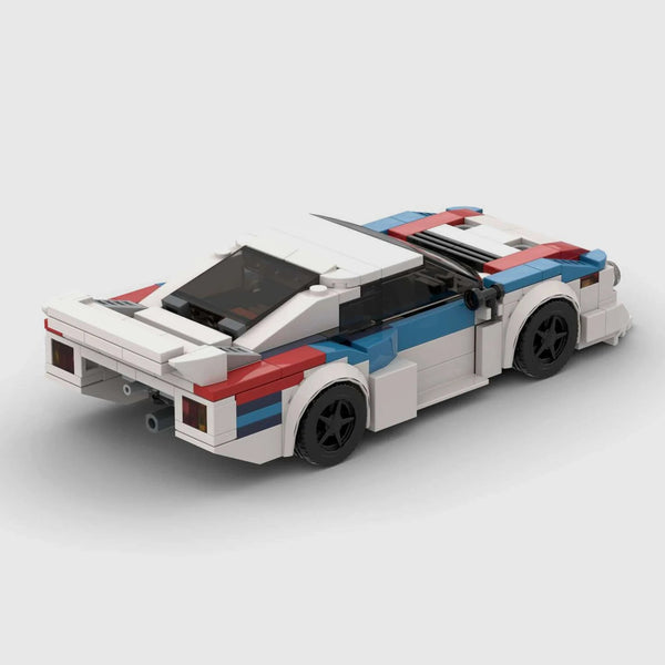 White with blue and red accents BMW M1 brick model rear three quarter view