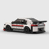 White with black and red accents BMW M240i brick model rear three quarter view