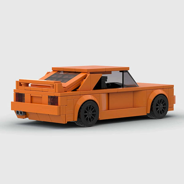Orange BMW M3 E30 brick model rear three quarter view