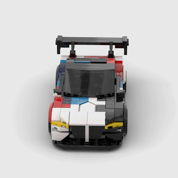 White, black, red, and blue motorsport livery BMW M4 GT3 brick model front view