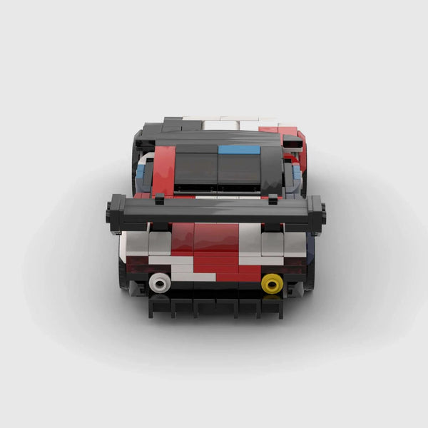 White, black, red, and blue motorsport livery BMW M4 GT3 brick model rear view