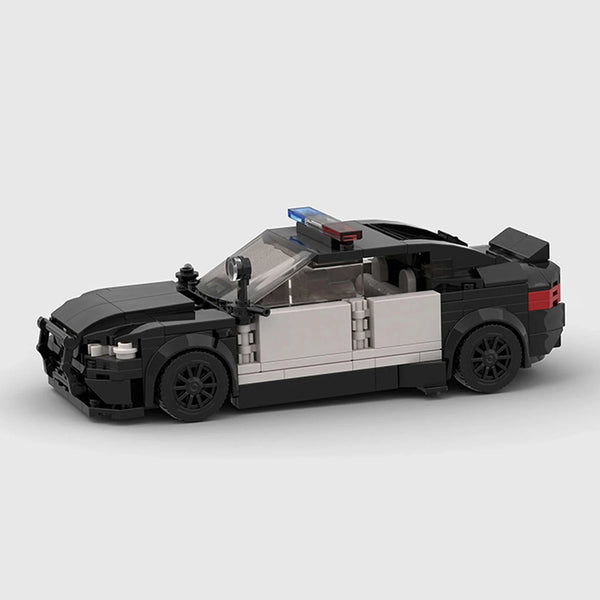 Black and white BMW M5 F90 brick model low 3q view
