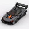 Dark grey and orange McLaren Senna GTR Grey Edition brick model high front three quarter view