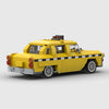 Yellow with black and white checkerboard stripe Checker Marathon brick model rear three quarter view
