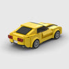 Yellow with black racing stripes Chevrolet Camaro brick model rear three quarter view