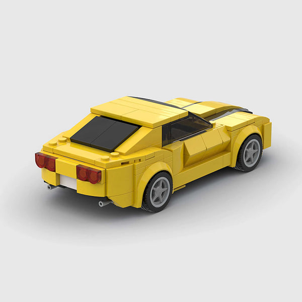 Yellow with black racing stripes Chevrolet Camaro brick model rear three quarter view