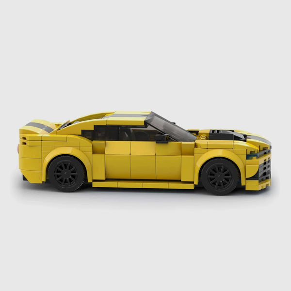 Bright yellow with black racing stripes Chevrolet Camaro brick model side profile view