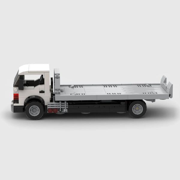 White cab with grey flatbed and black chassis brick model side profile view