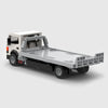 White cab with grey flatbed and black chassis brick model rear three quarter view