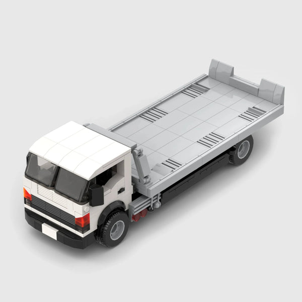 White cab with grey flatbed and black chassis brick model close up detail view