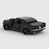 Black Ford Mustang Fastback brick model rear three quarter view