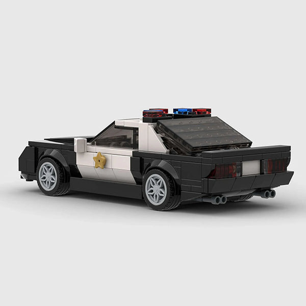 Black and white police livery Ford Mustang brick model rear three quarter view