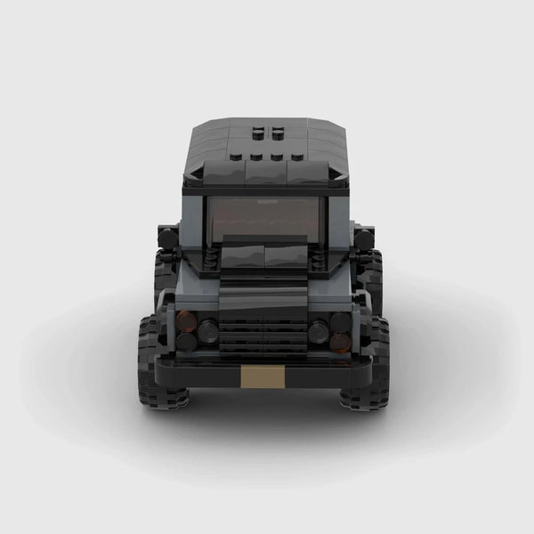 Grey with black roof and accents Land Rover Defender 90 brick model front view