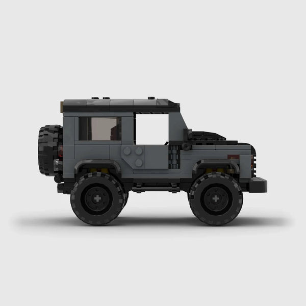 Grey with black roof and accents Land Rover Defender 90 brick model side profile view