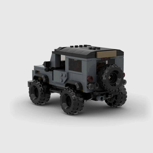 Grey with black roof and accents Land Rover Defender 90 brick model rear three quarter view