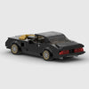 Black with gold accents Pontiac Firebird Trans Am brick model rear three quarter view