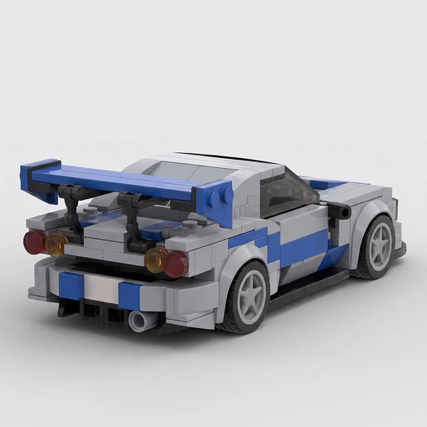 Silver and blue Nissan R34 GTR brick model rear three quarter view