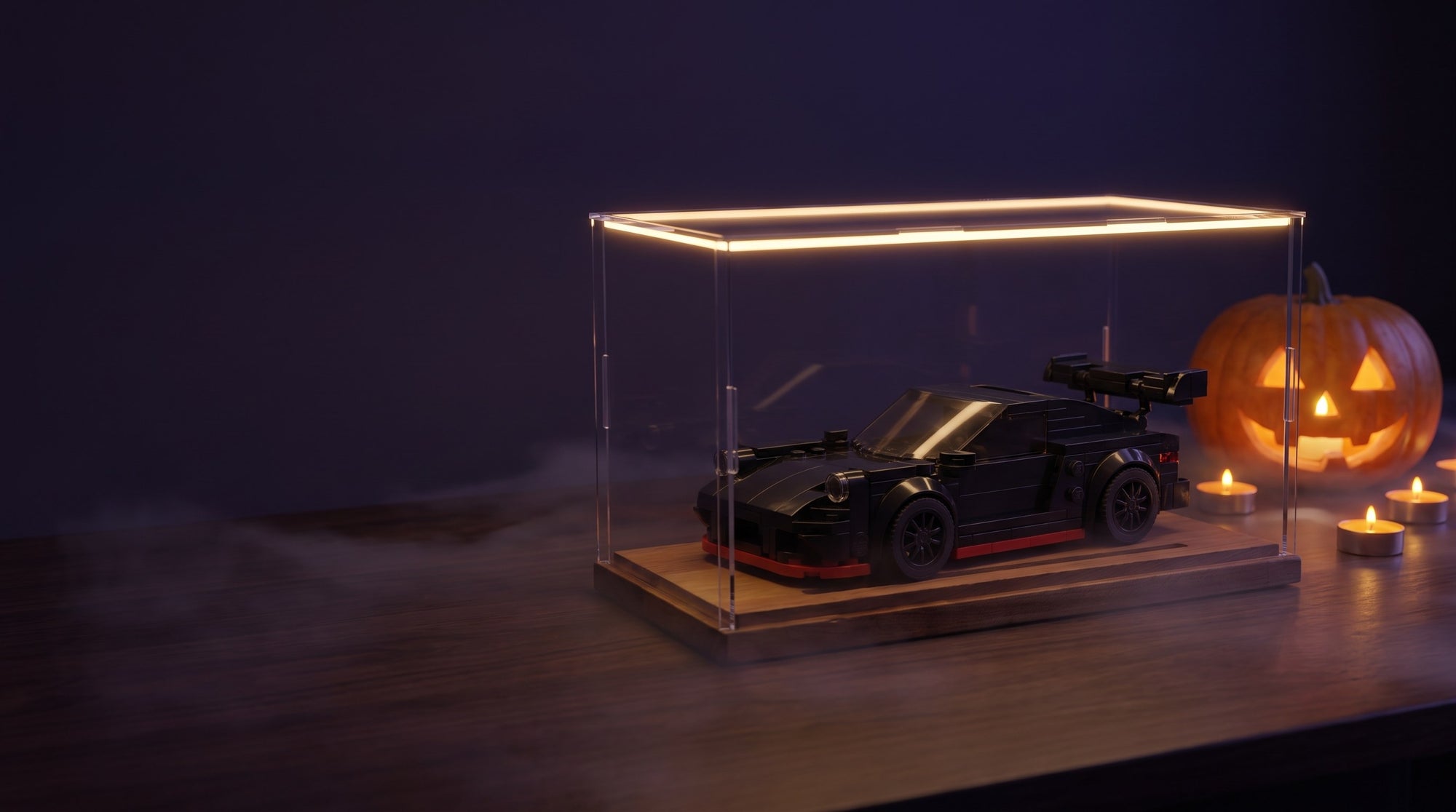 Black brick car model in its LED display case, Halloween offer
