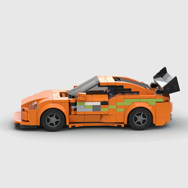Orange with green accents Toyota Supra brick model side profile view