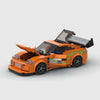 Orange with green accents Toyota Supra brick model close up detail view